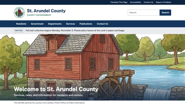 The St. Arundel County website: the county seal, a navy menu, a notice about fall leaf collection, and the old gristmill beneath the welcome
